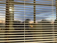 a view of a window with blinds